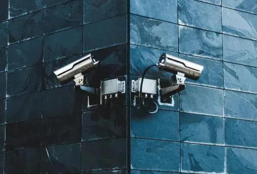 A set of security cameras facing opposite directions